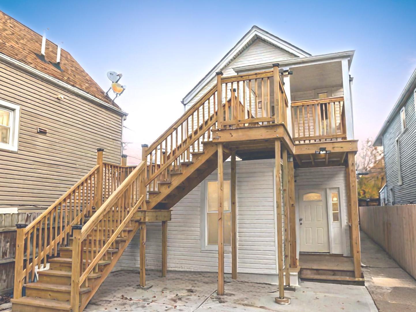 a view of a house with wooden stairs