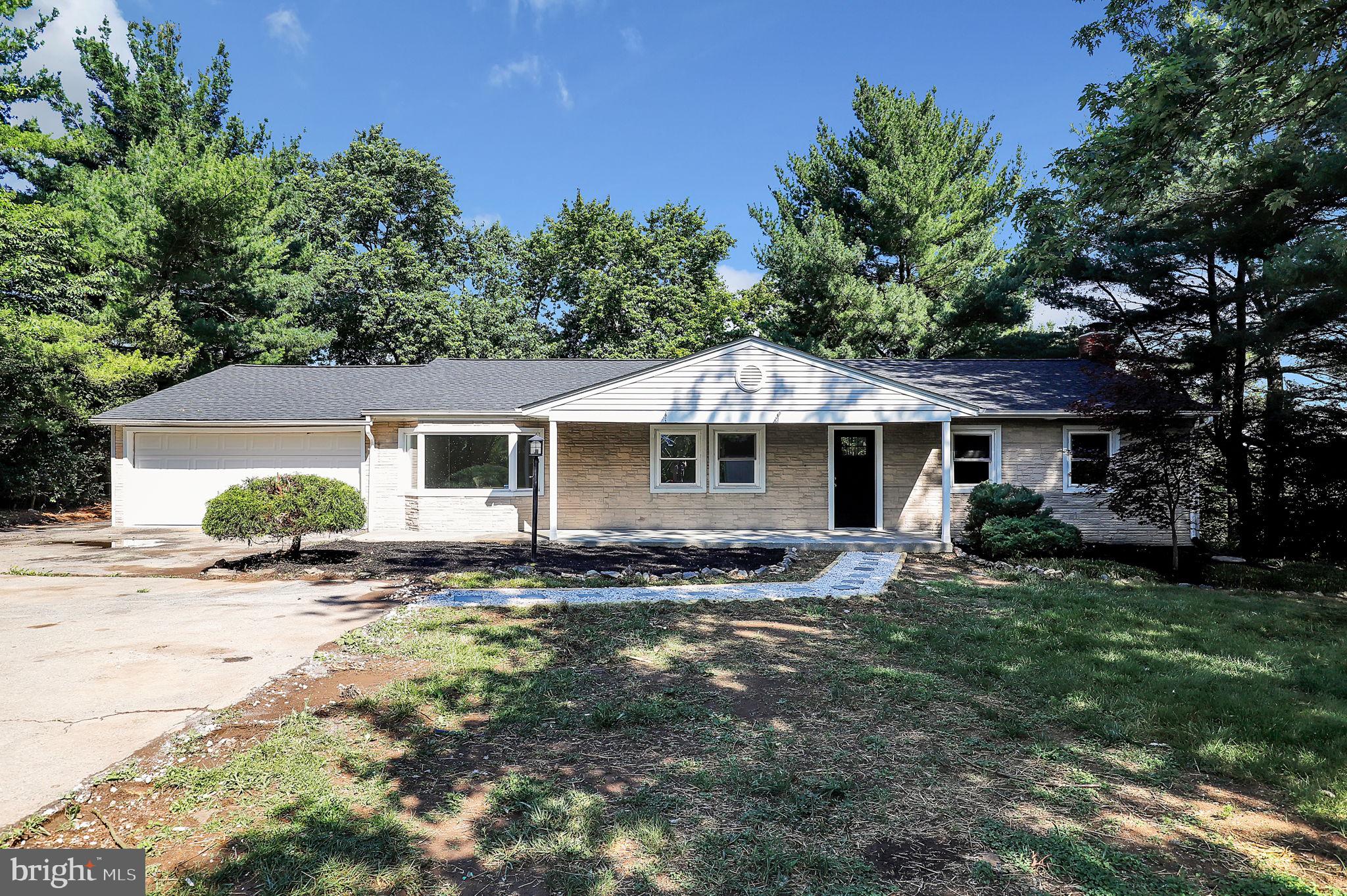 a front view of a house with yard