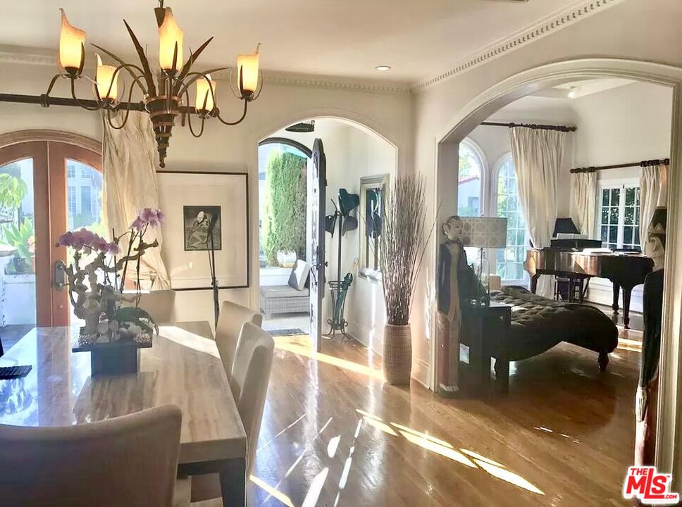 a lobby with furniture and wooden floor