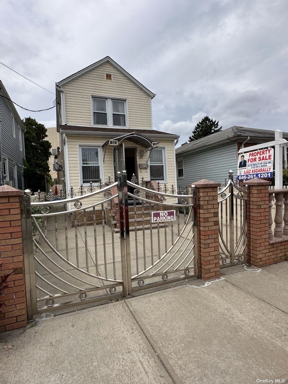 a front view of a house with garage