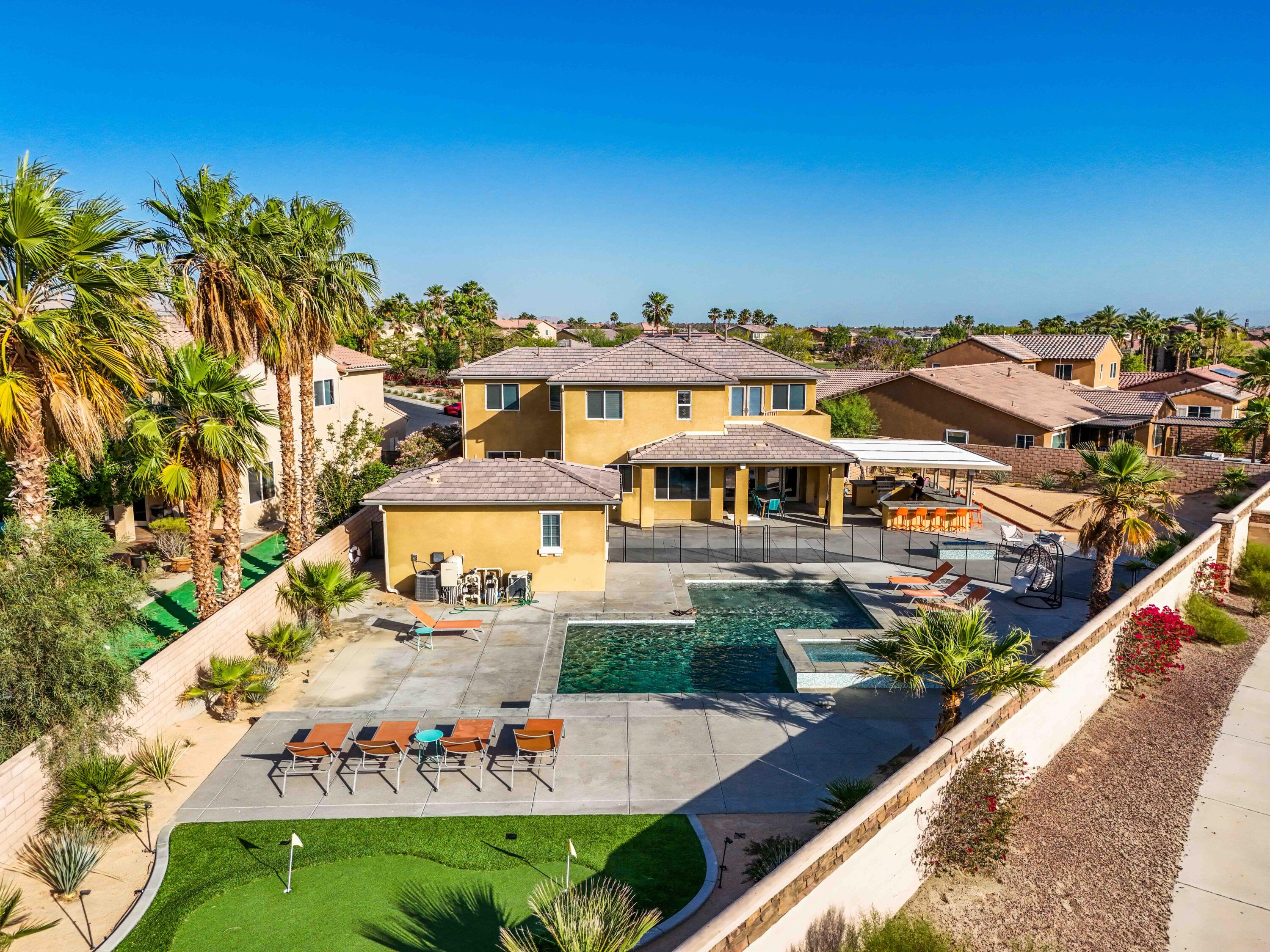 an aerial view of a house with outdoor space