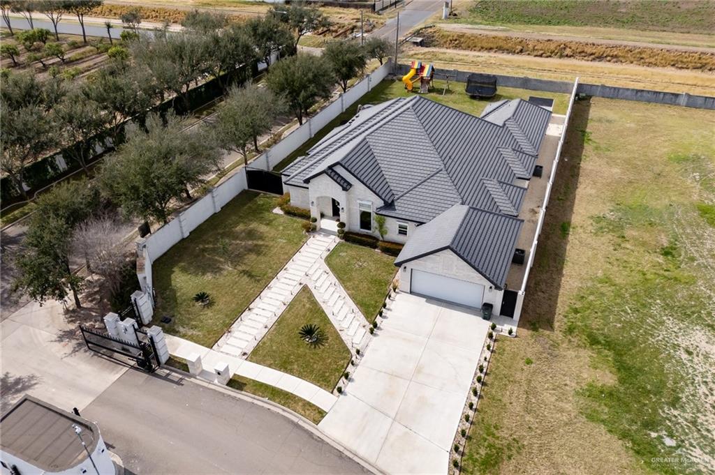 an aerial view of house with yard