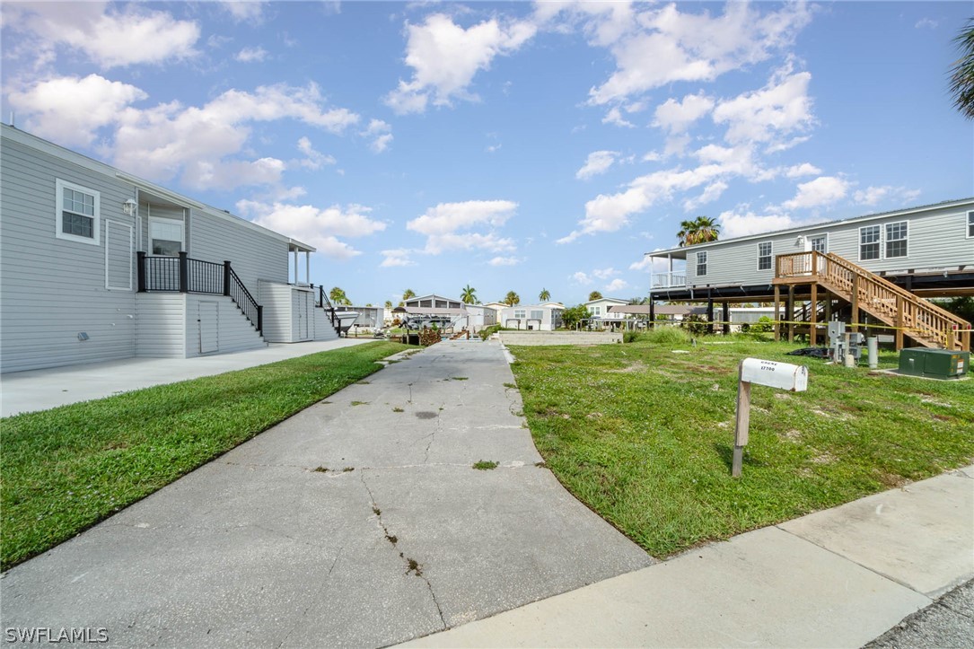 a view of a street with a big yard