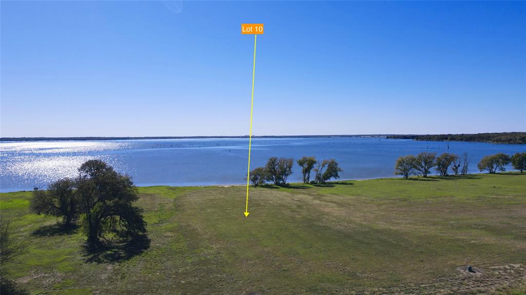 a view of a field with an ocean