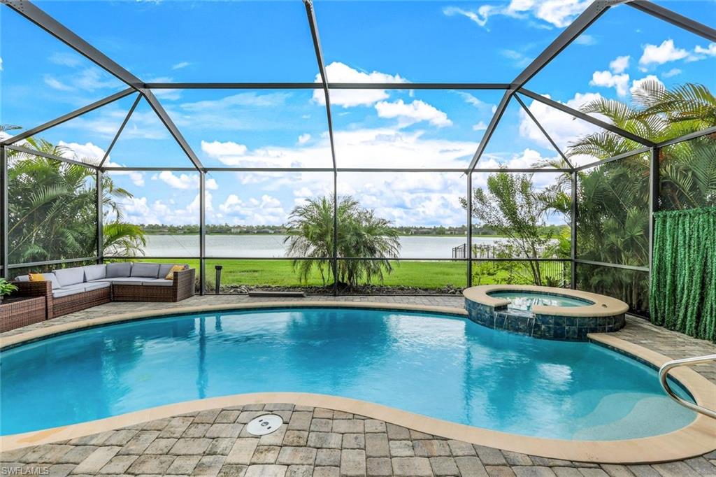 a view of a living room and floor to ceiling window or swimming pool