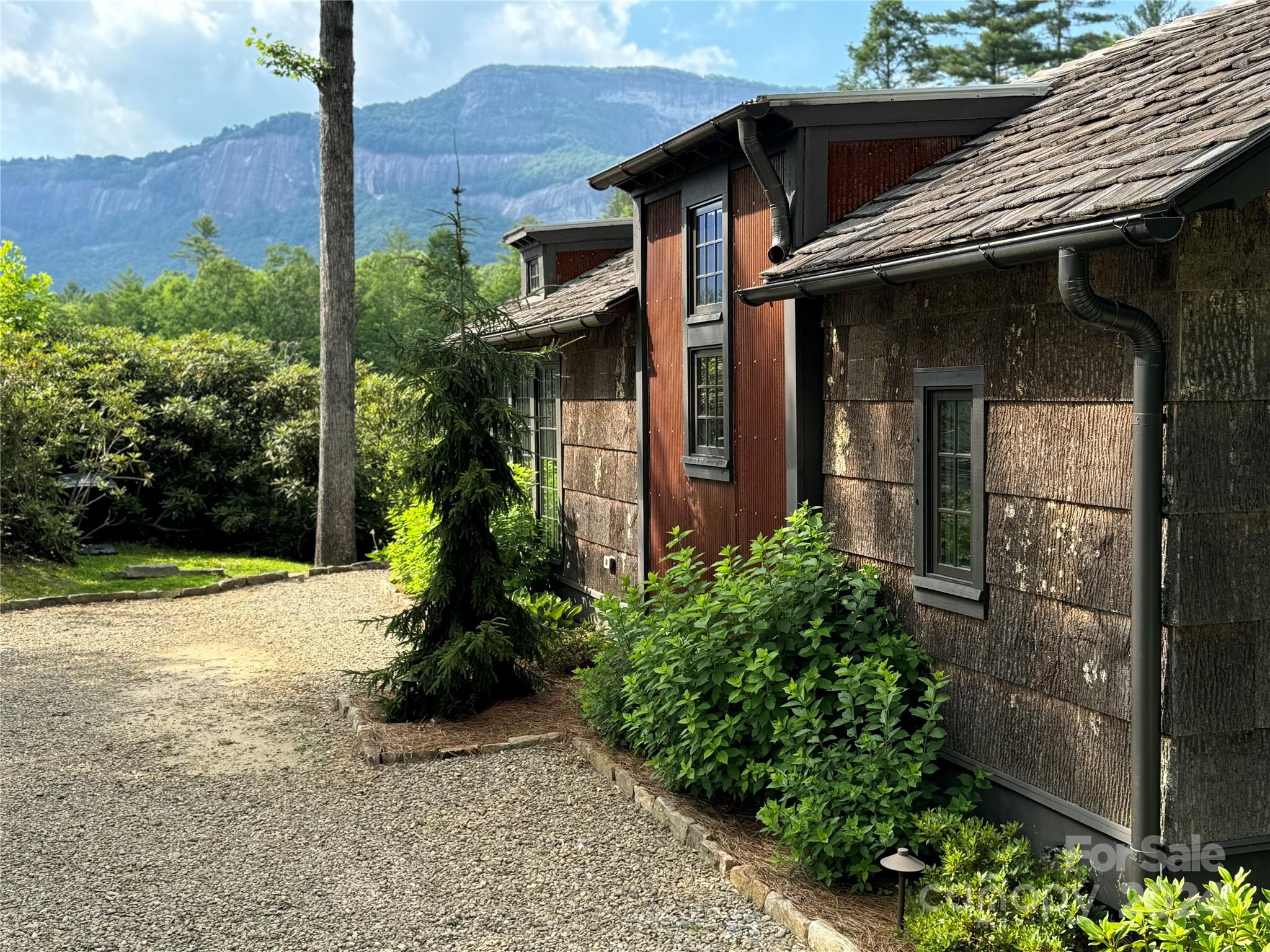 front view of a house with a garden