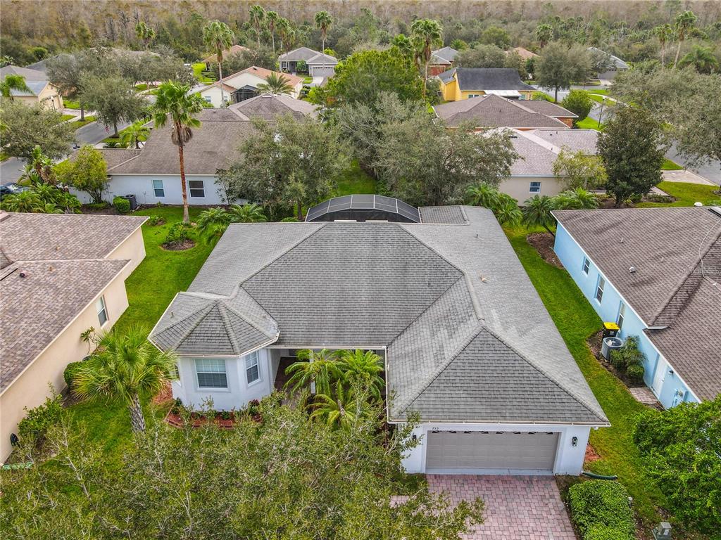 an aerial view of a house with a garden