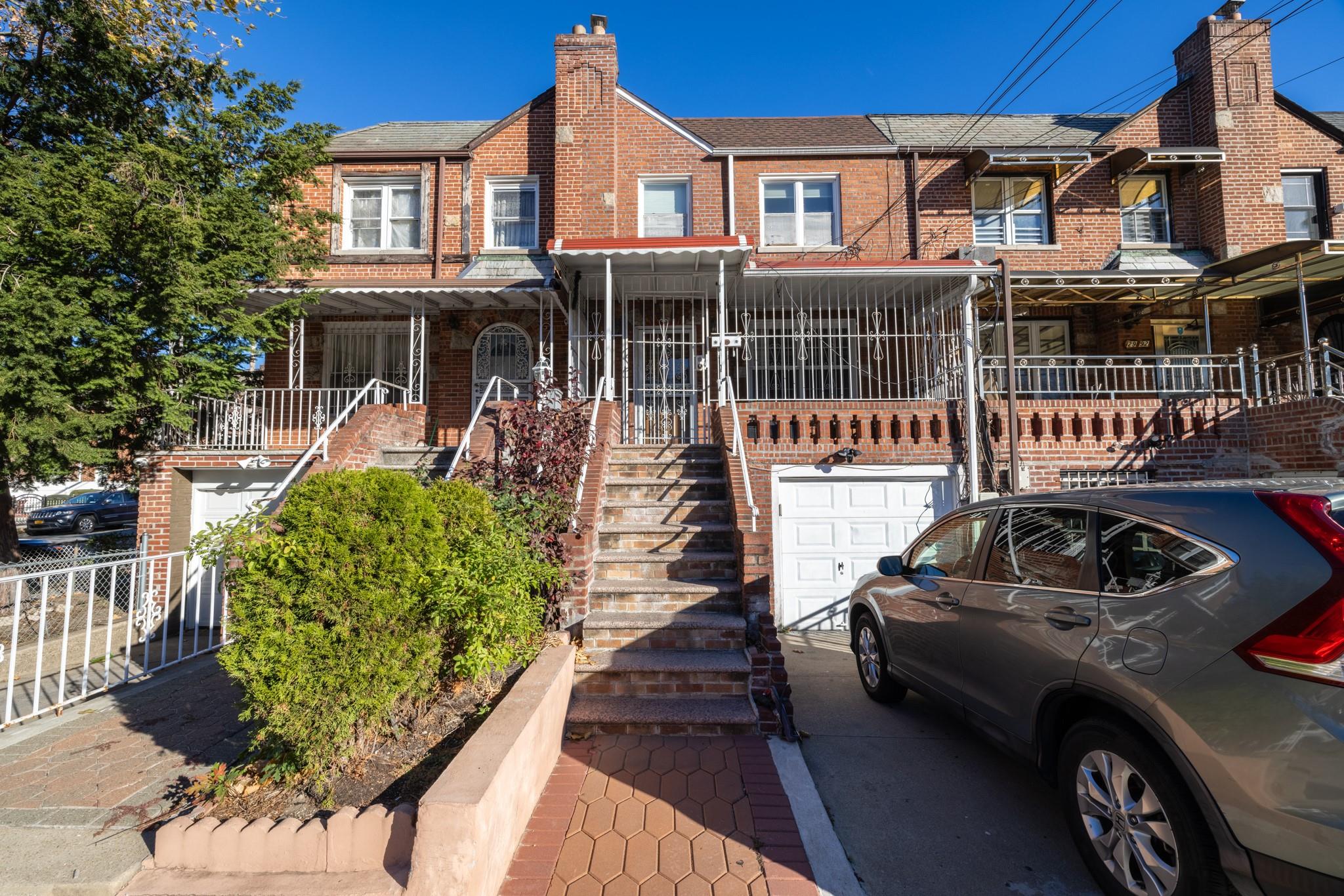 Townhome / multi-family property featuring a garage