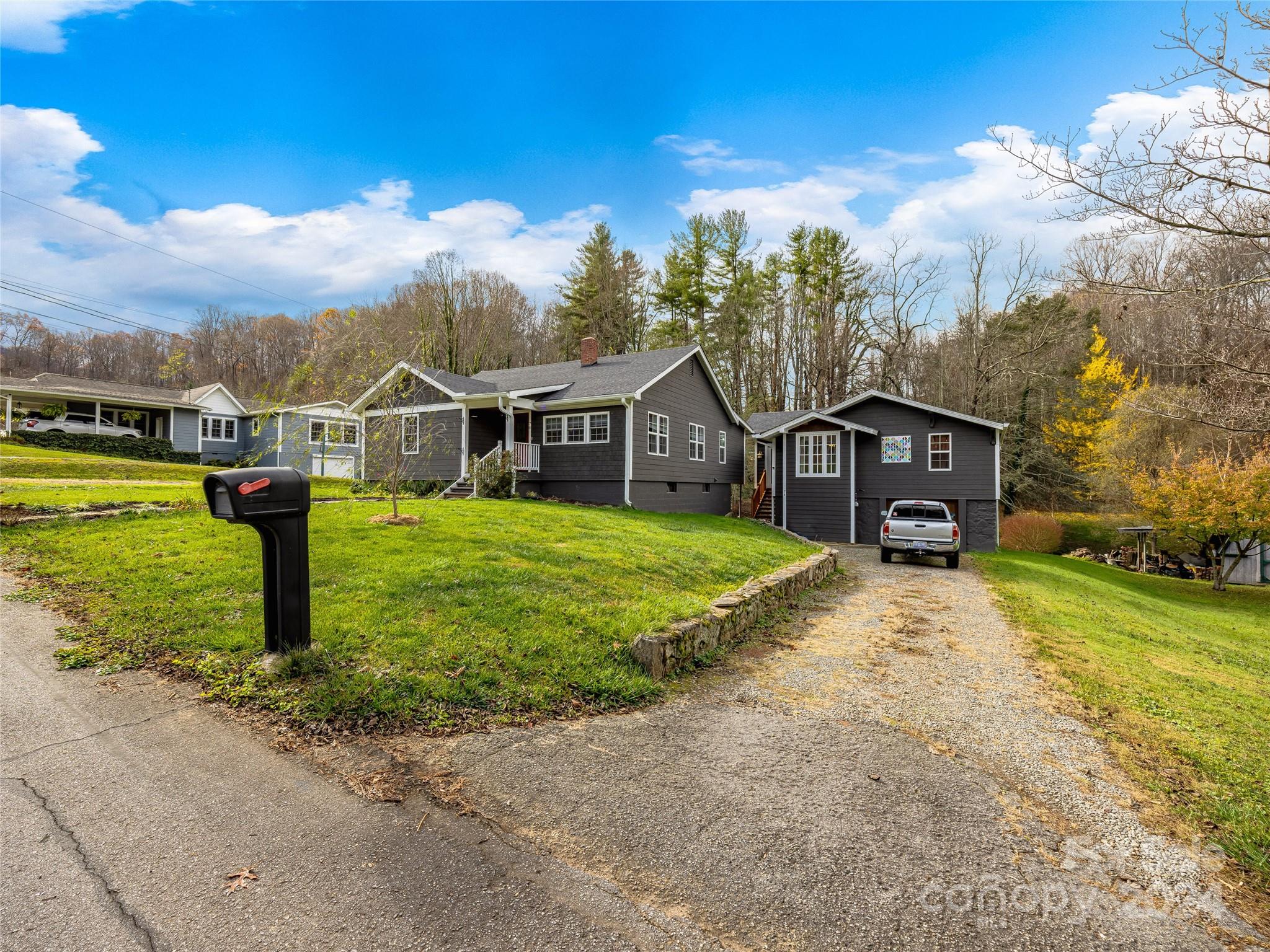 a view of a house with a yard