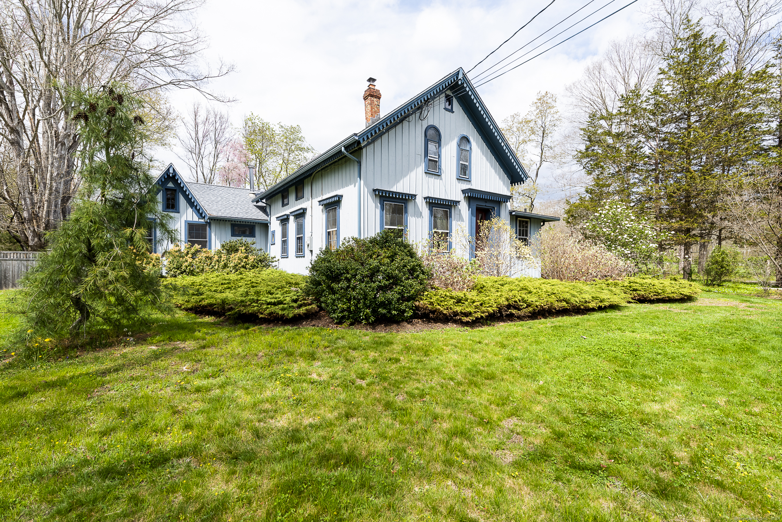 a front view of house with yard and green space