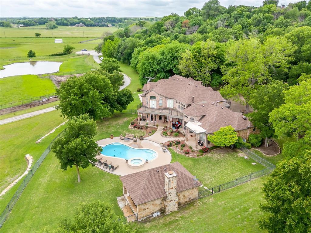 an aerial view of a house with a garden