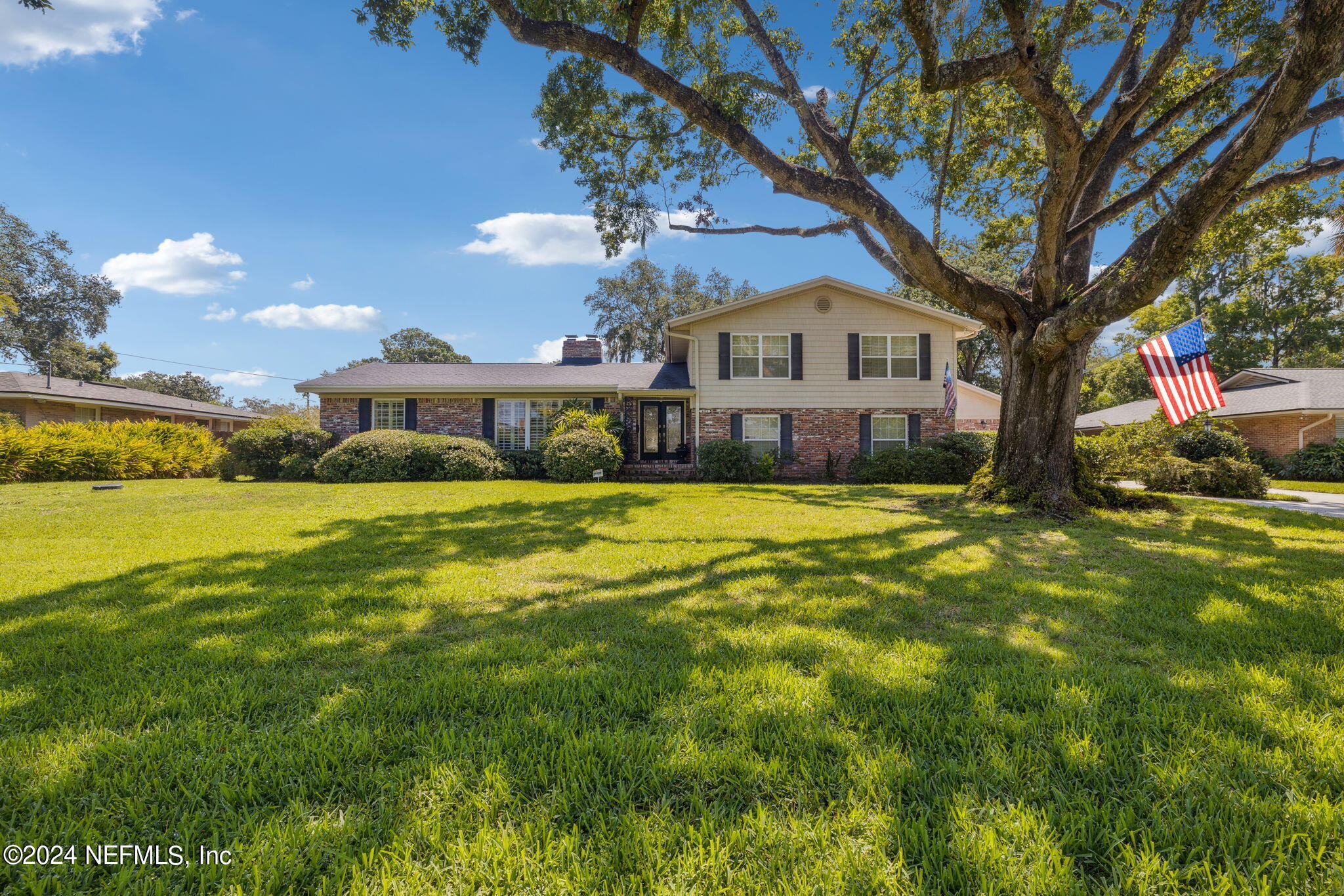 a front view of a house with a yard