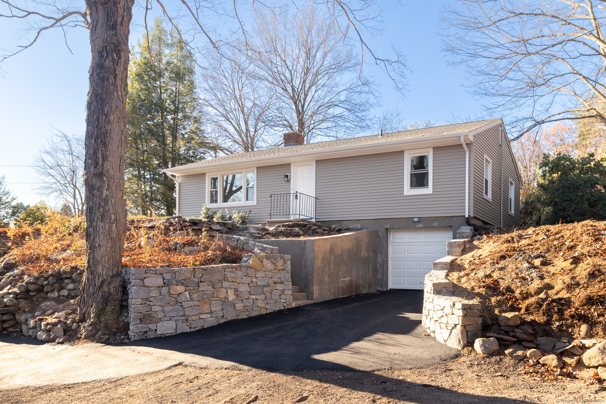 a view of house with backyard