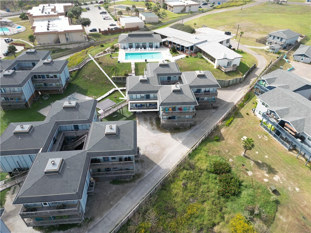 an aerial view of a swimming pool with outdoor space