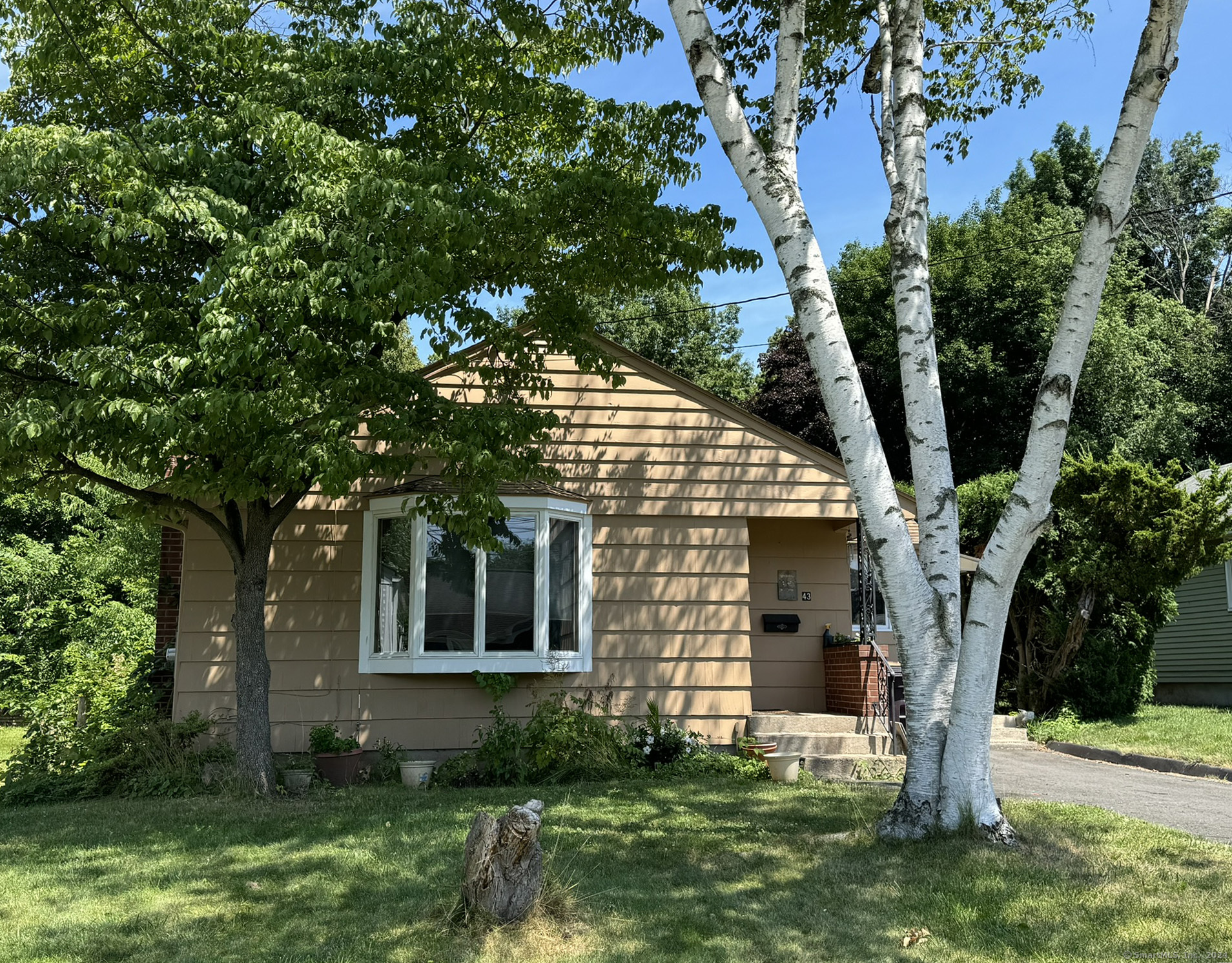 a front view of house with yard