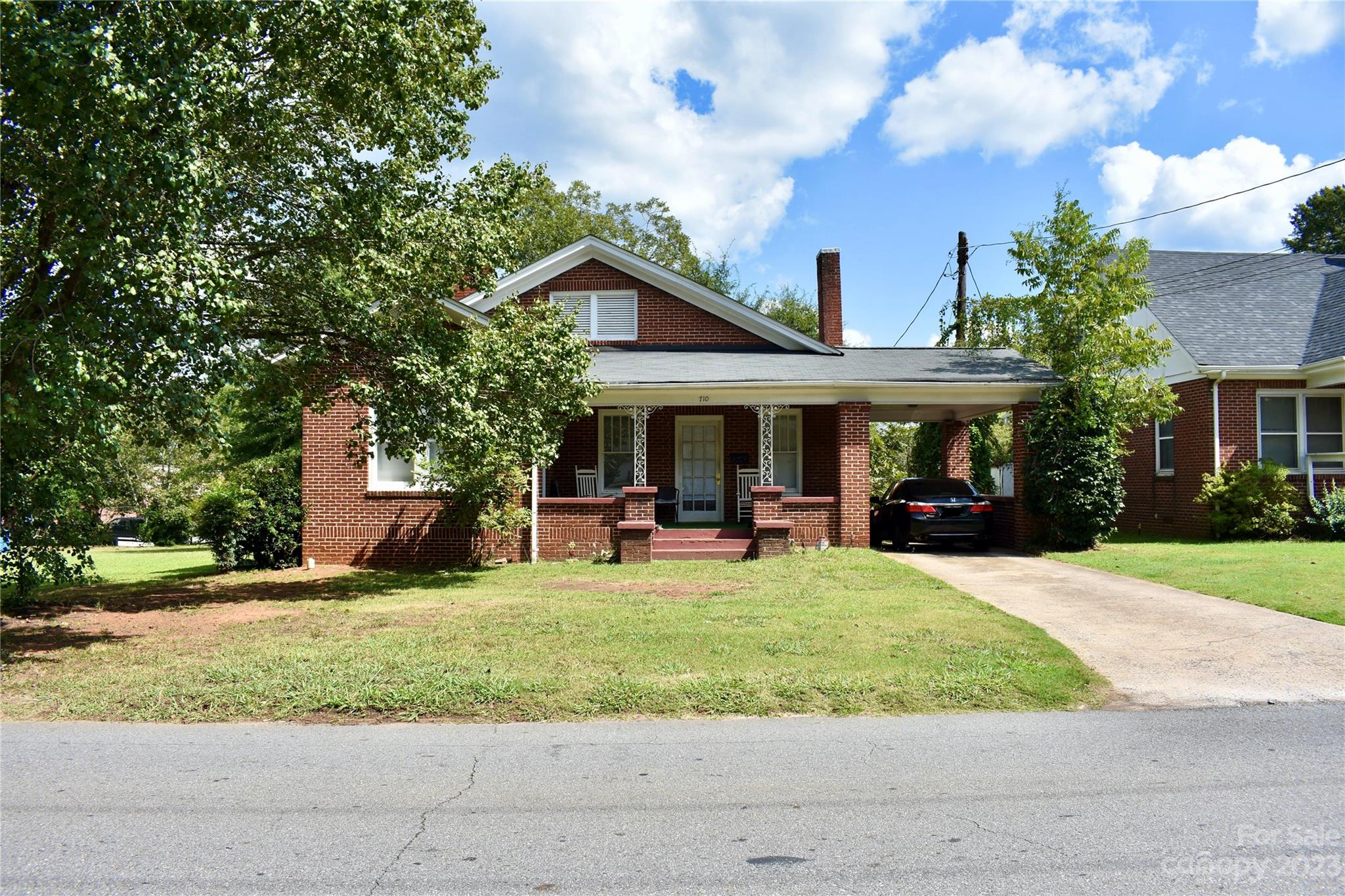 a view of house with outdoor space and porch