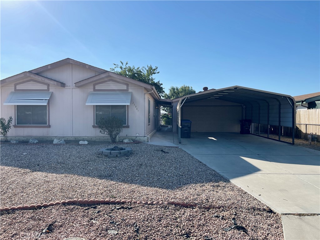 a view of a house with a yard and garage