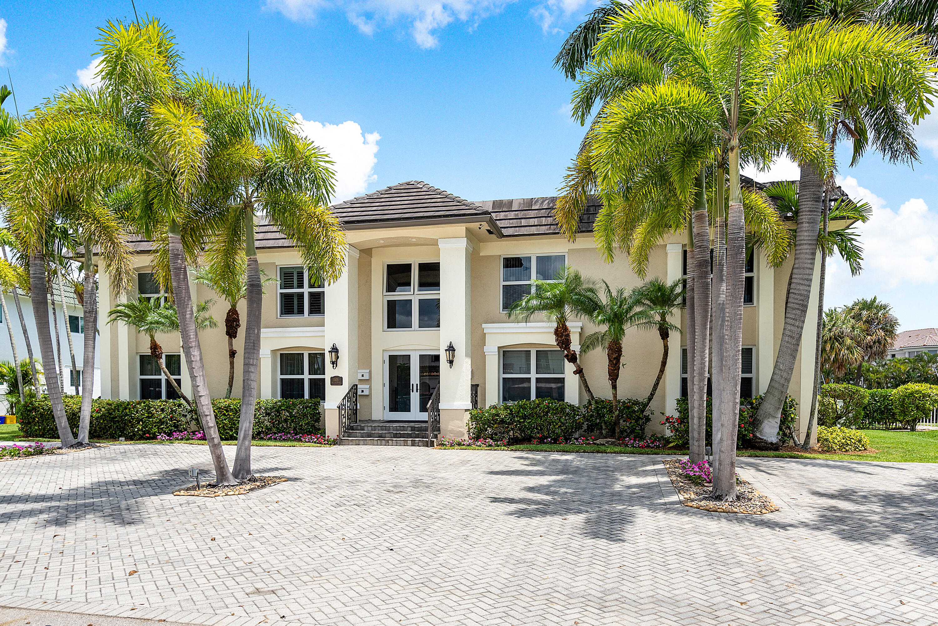 a view of a building with palm trees