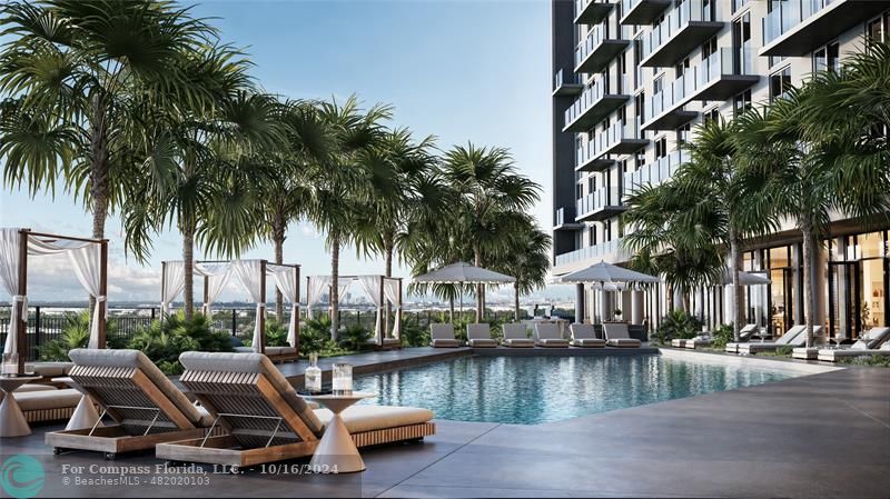 a view of swimming pool with outdoor seating and lake view