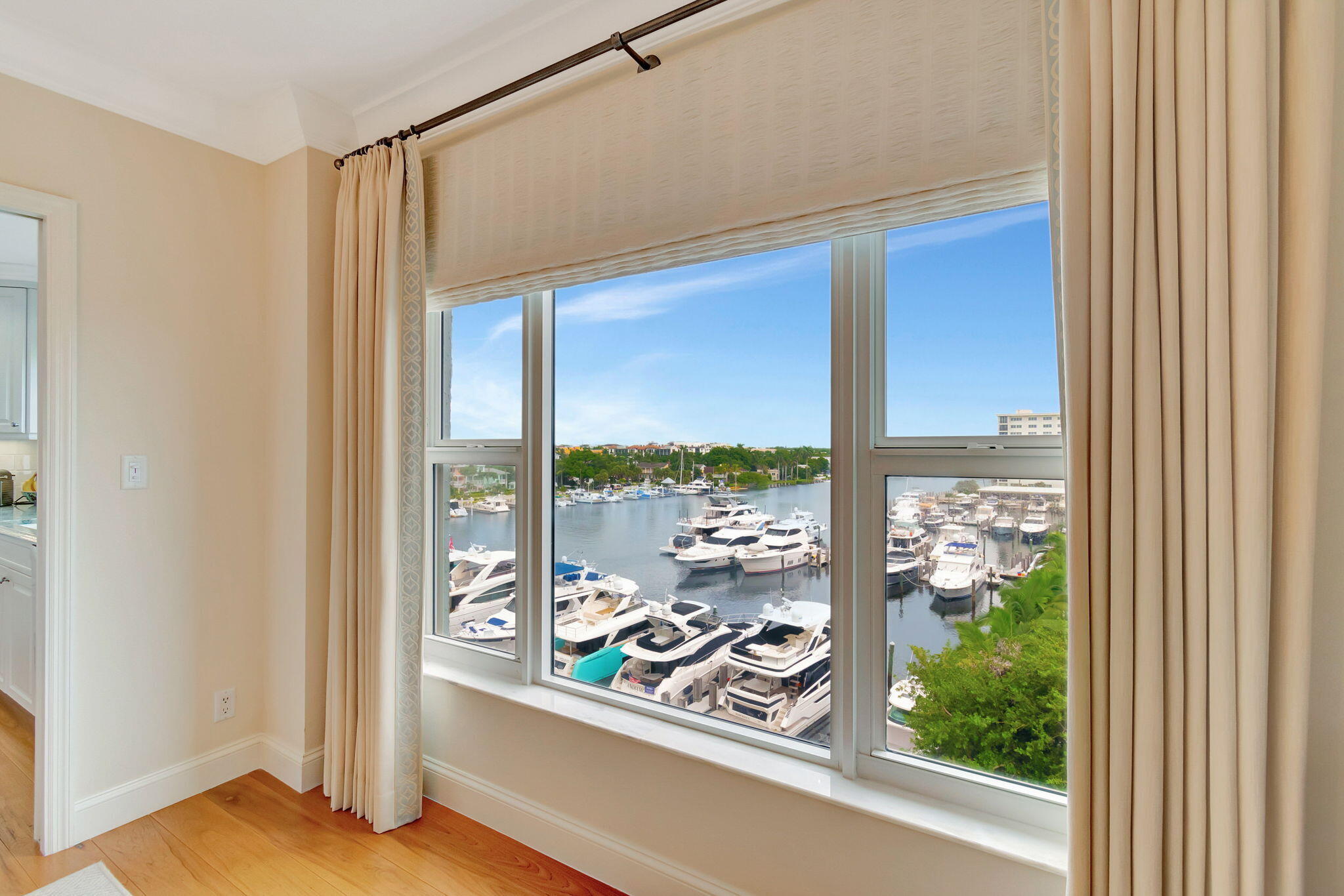 a view of a living room with a floor to ceiling window and floor to ceiling window