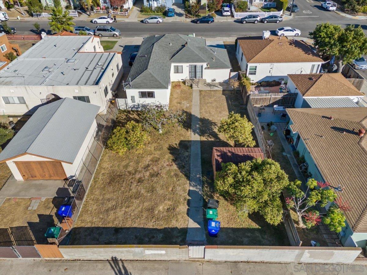 an aerial view of a residential houses with street