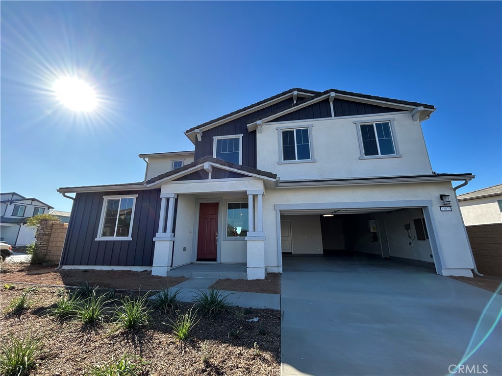 a front view of a house with garage