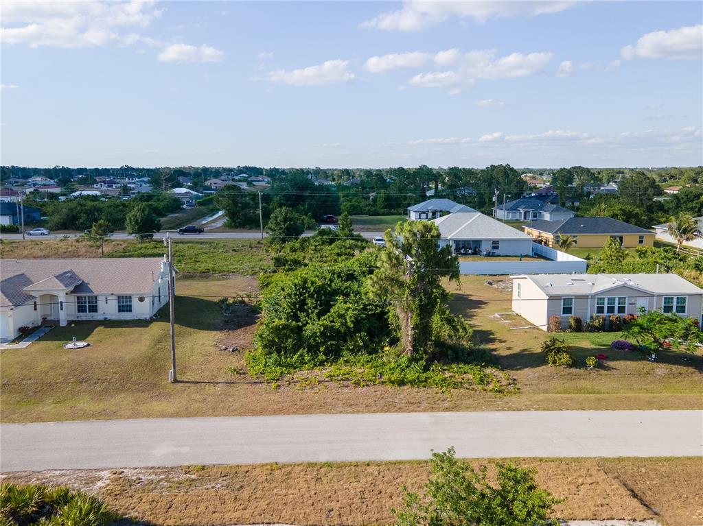 an aerial view of a house with lake view