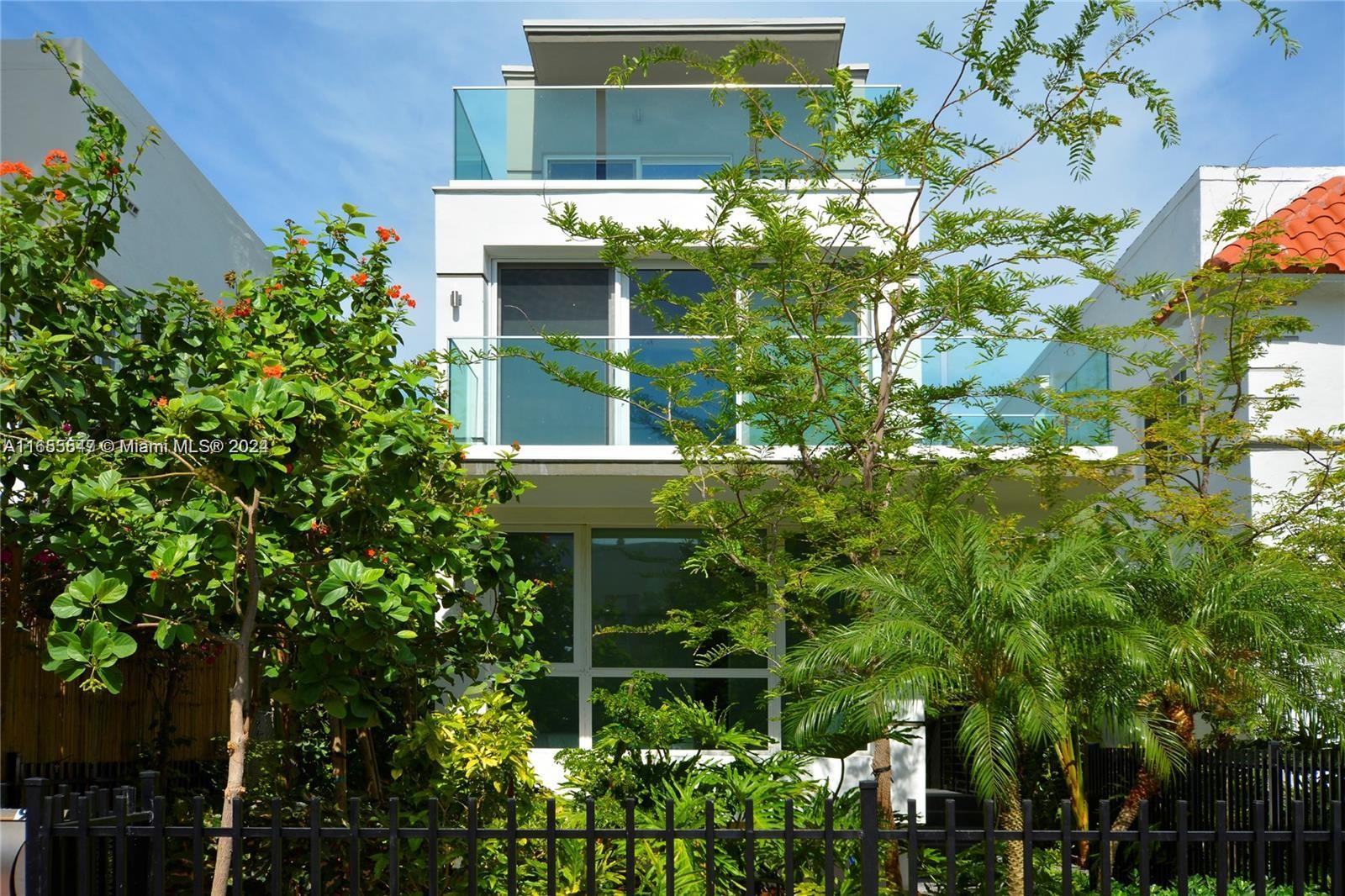 a view of a house with a tree park