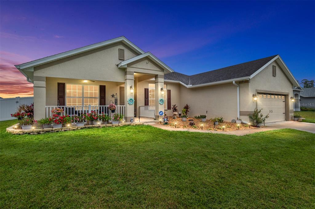 a front view of house with yard patio and green space