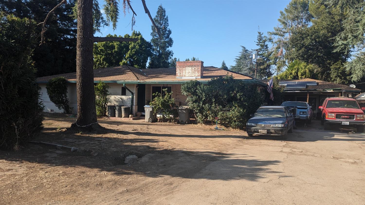 a view of a car park in front of house