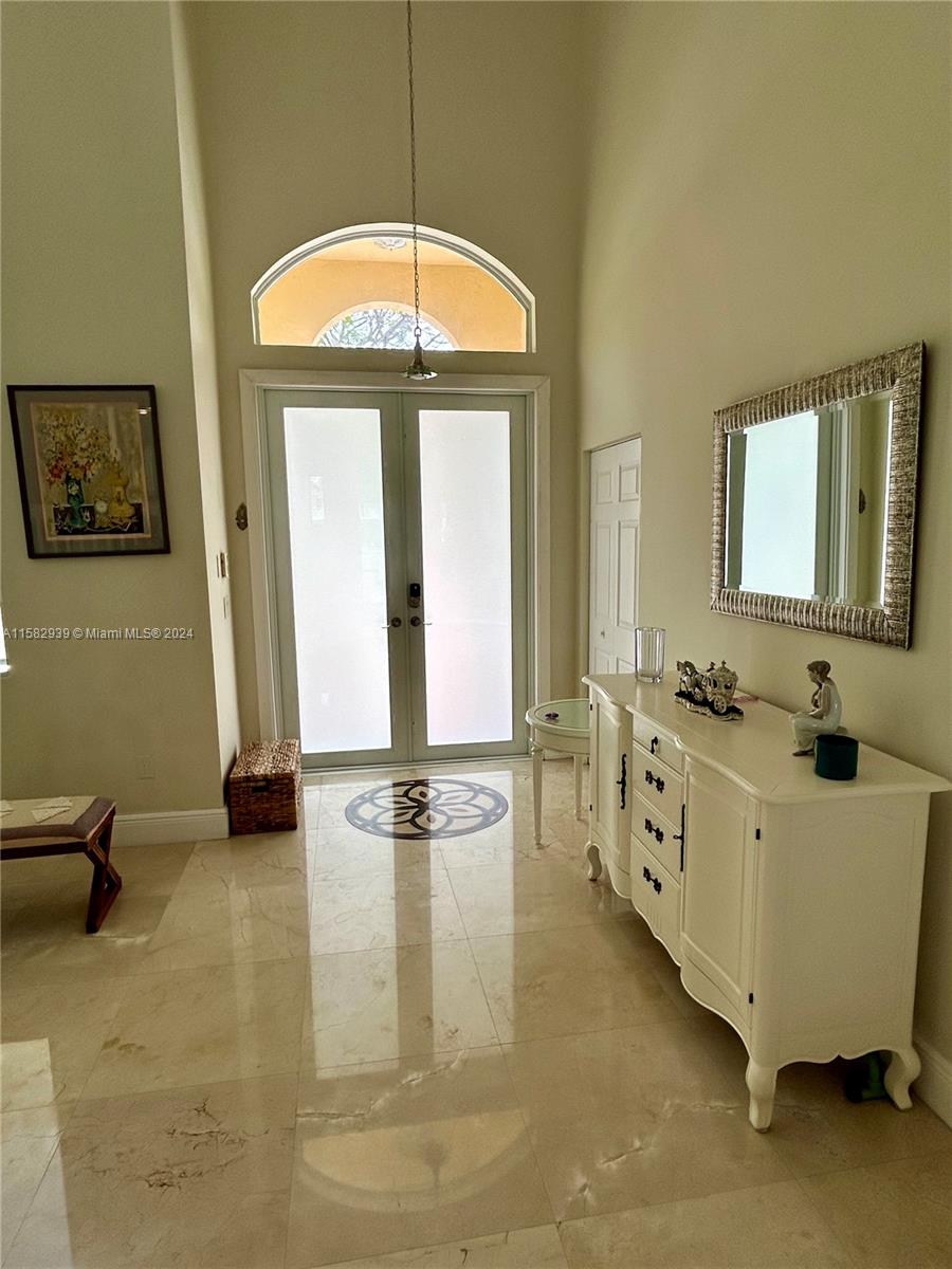 a spacious bathroom with sinks mirror and tub