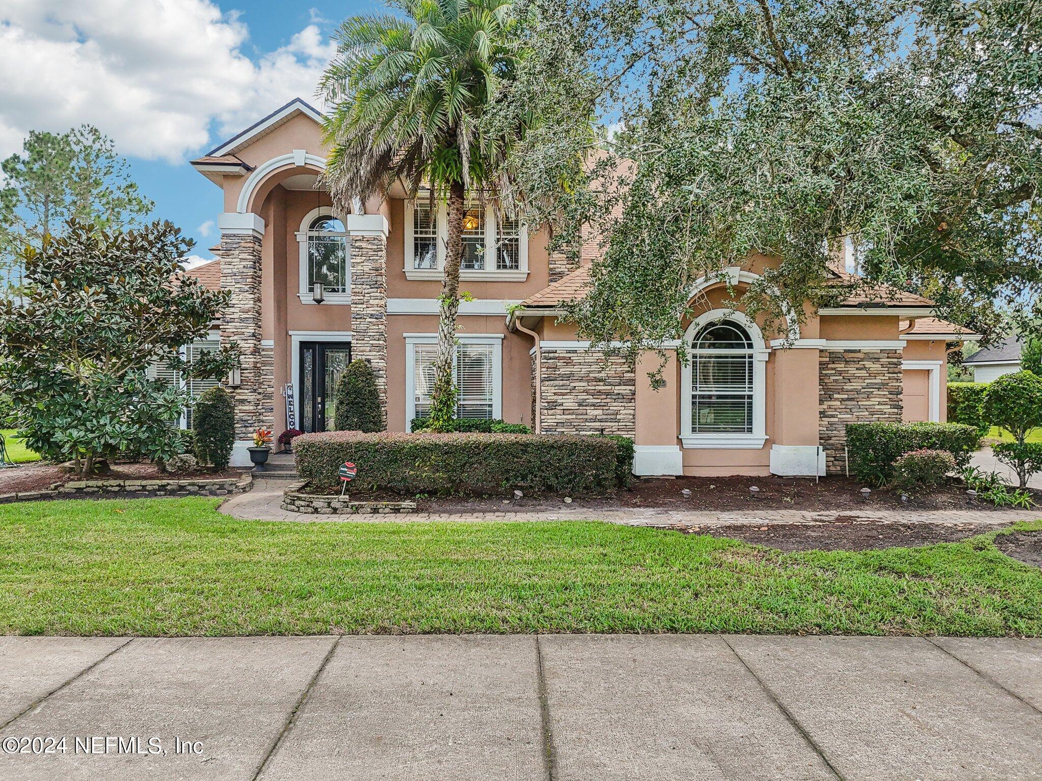 a front view of a house with a yard