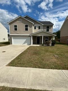 a front view of a house with yard