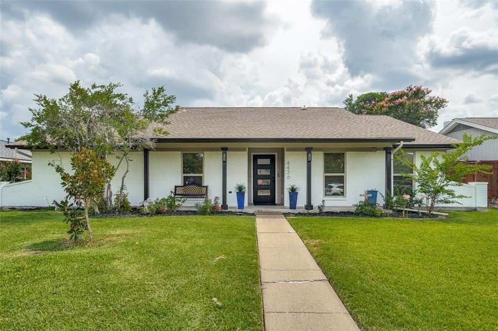 a front view of a house with a yard and porch