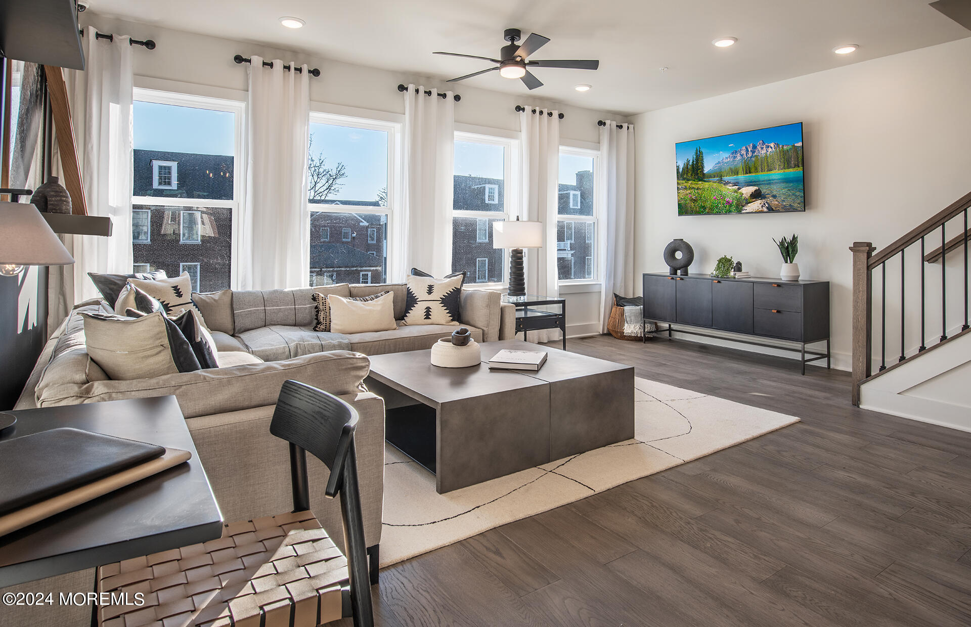 a living room with furniture and a flat screen tv