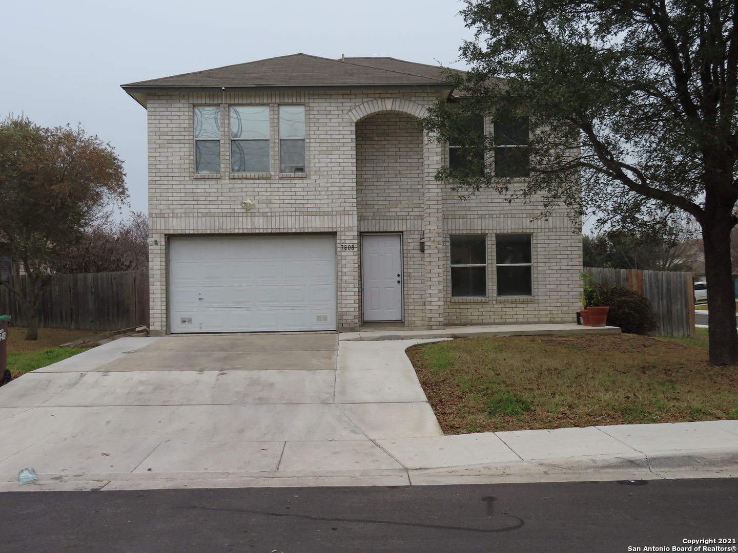 a front view of a house with garage