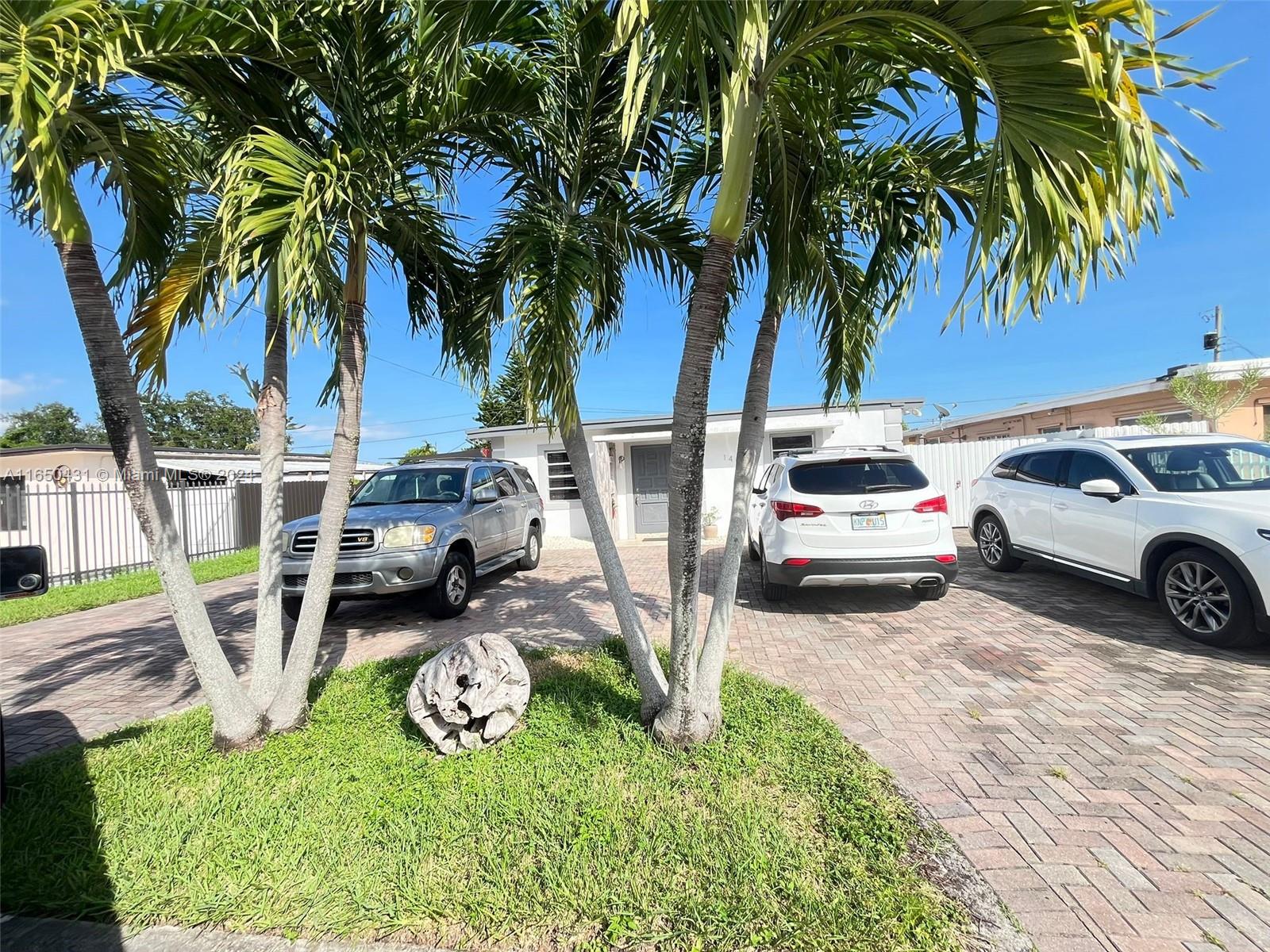 a view of a backyard with a car parked