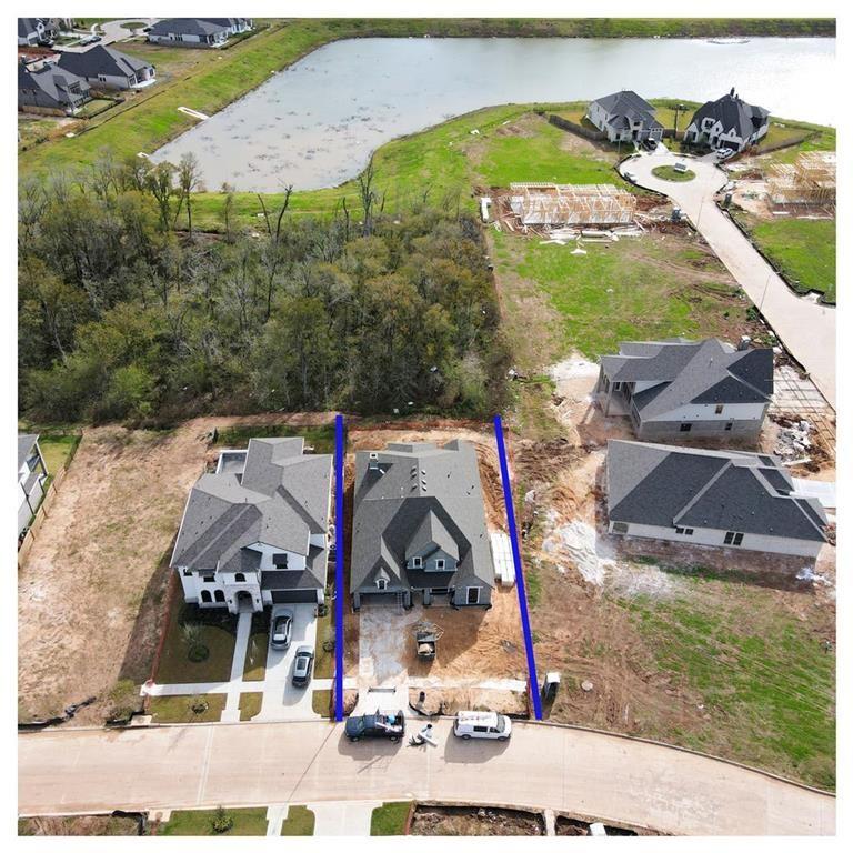 a view of multiple houses with a big yard