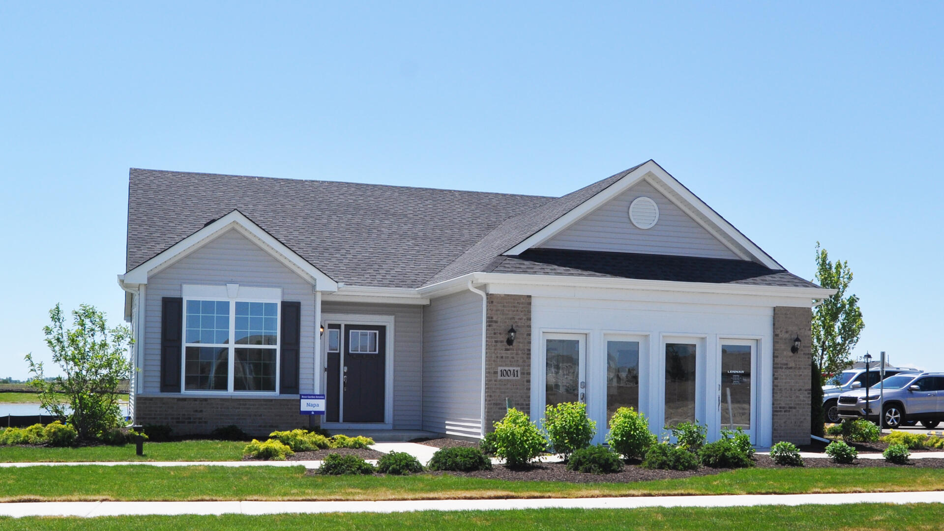 front view of a house with a yard