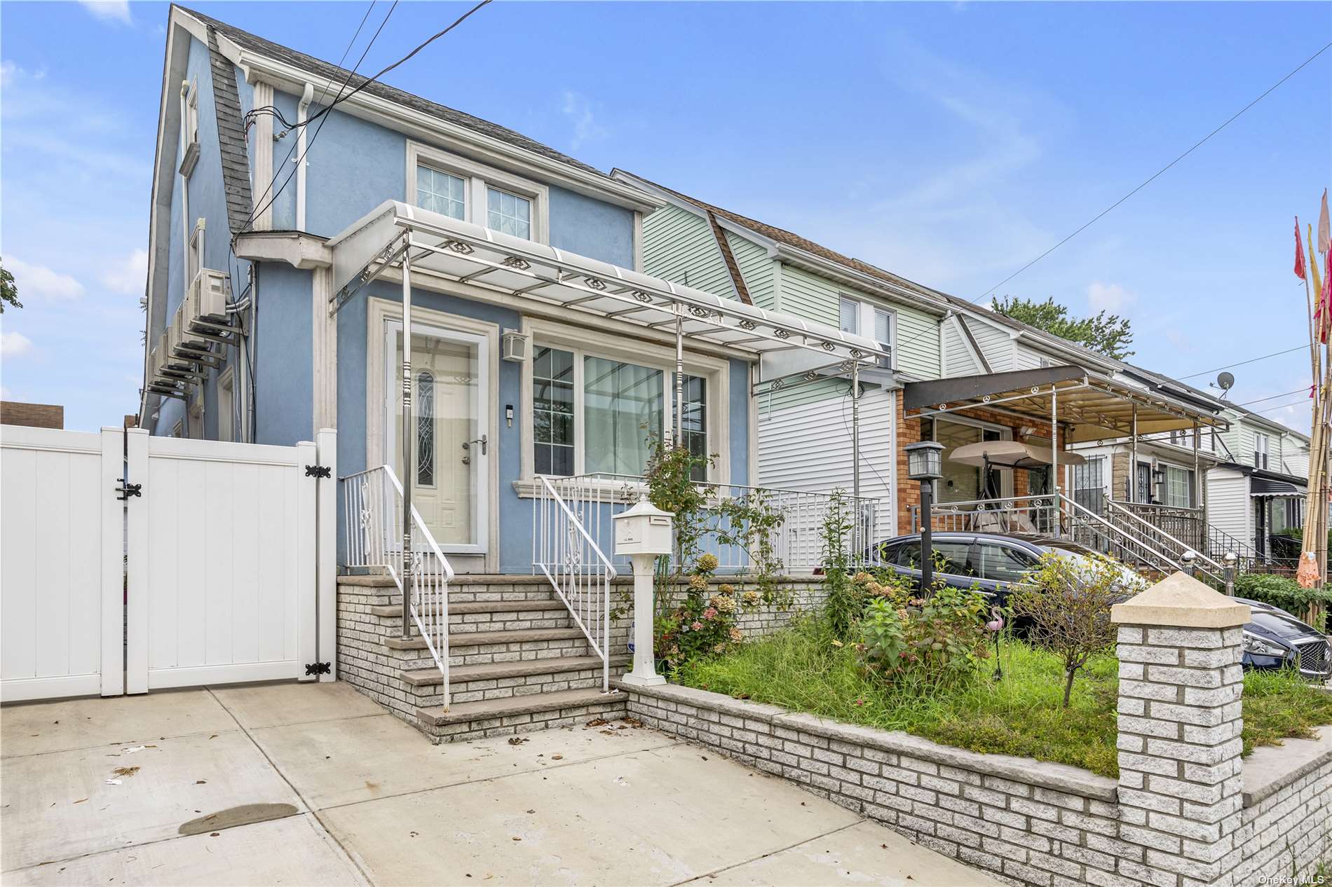 front view of a house with a bench