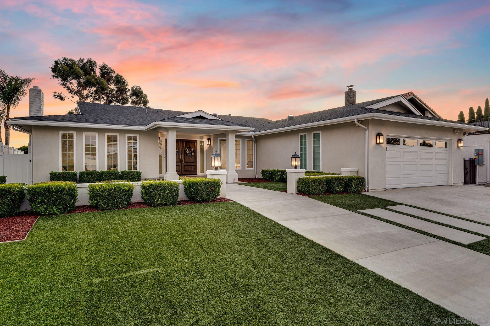 a view of a house with a back yard