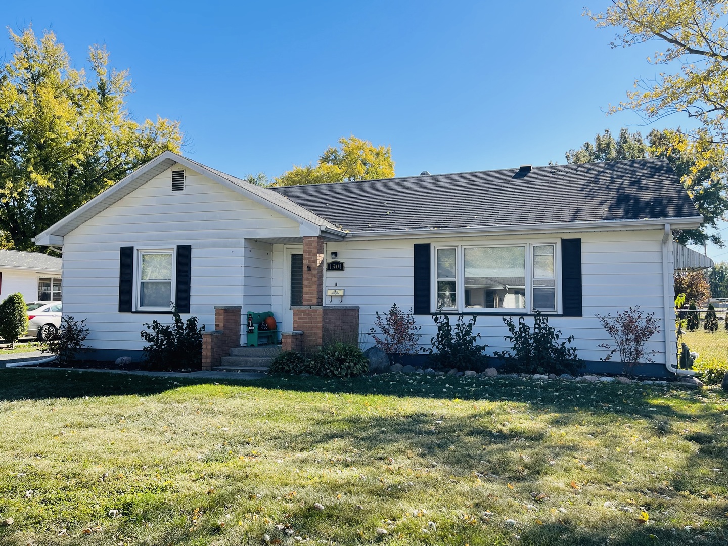 a front view of house with yard and outdoor seating