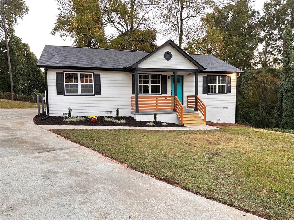 a front view of a house with yard