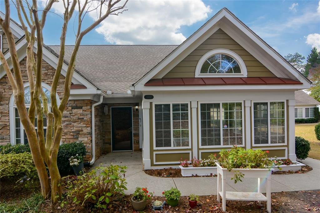 a front view of a house with garden