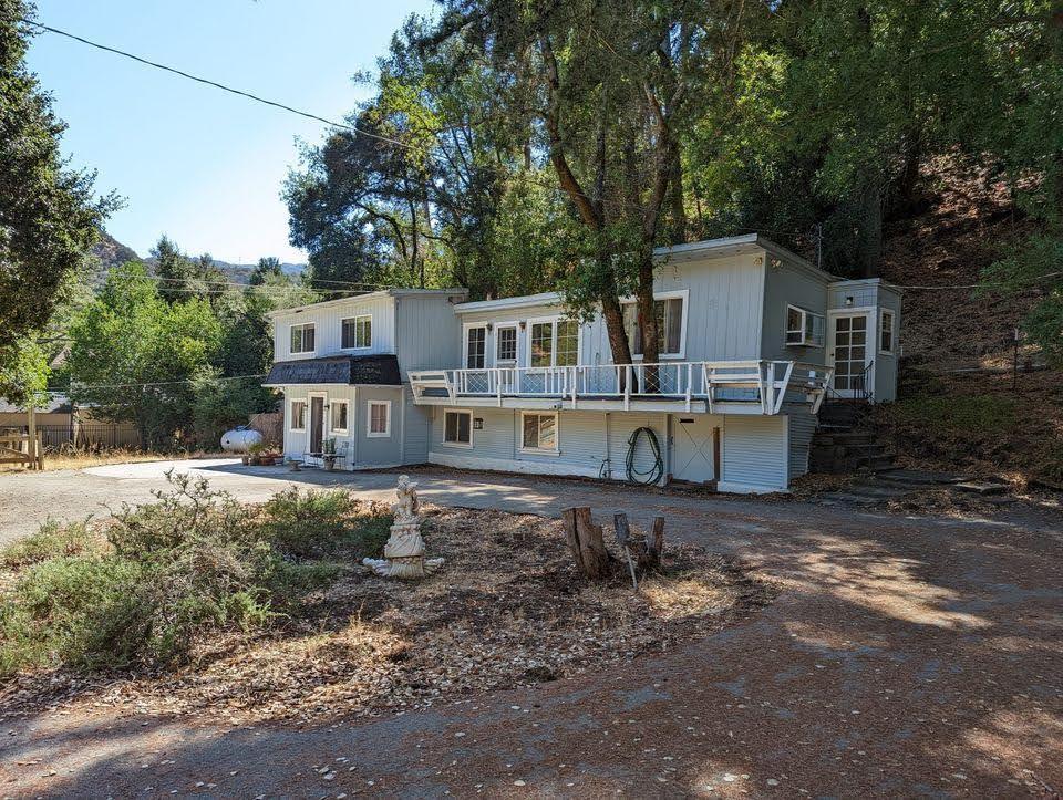 a house that has tree in front of it