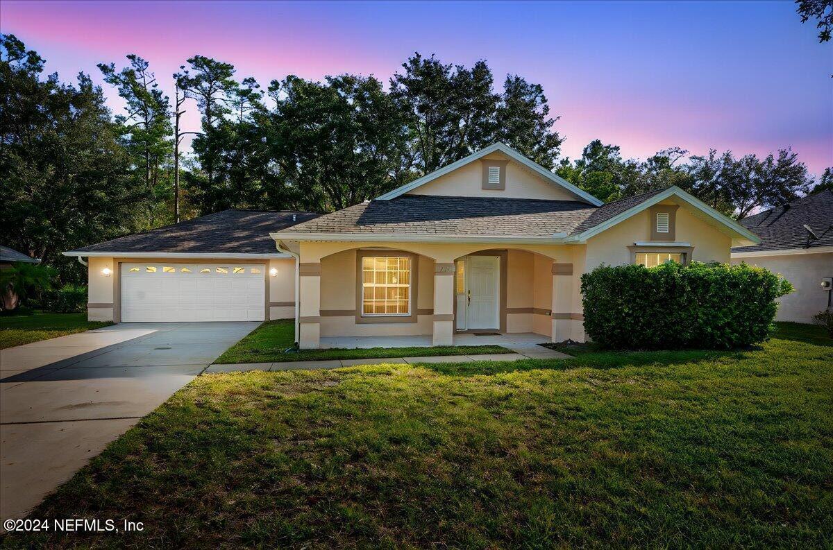 a front view of a house with a yard