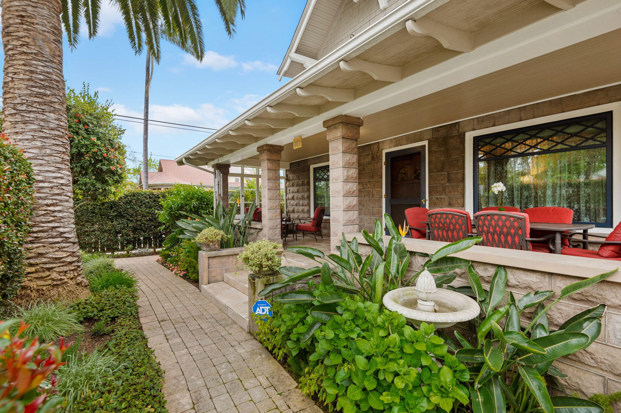 a view of a house with backyard outdoor seating area