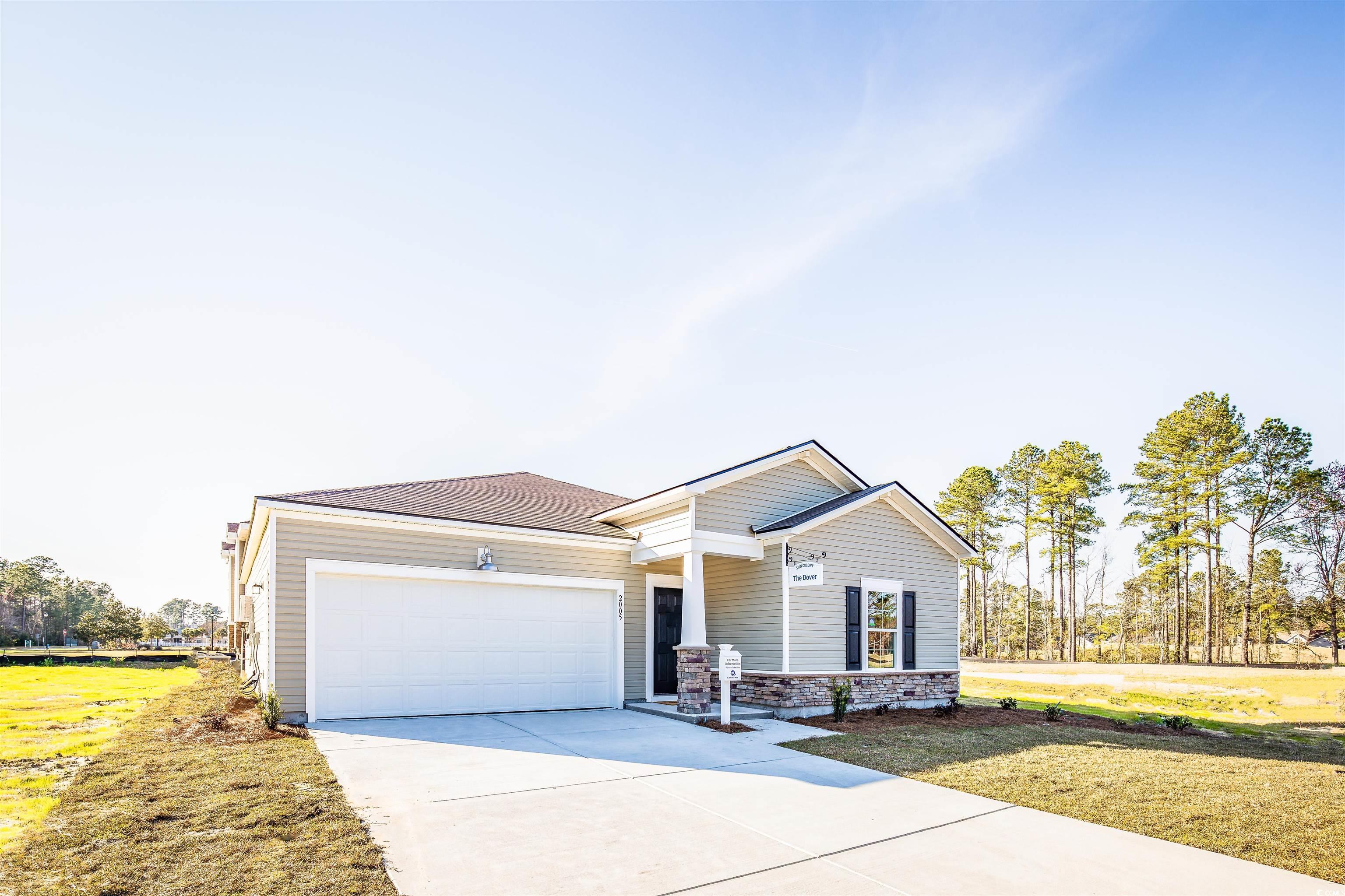 View of front of house featuring a garage and a fr