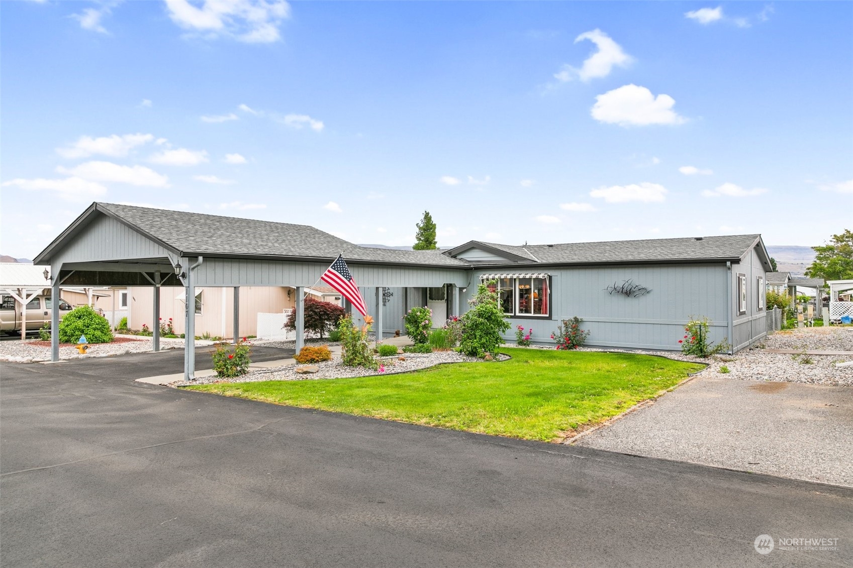 a front view of house with yard and outdoor seating