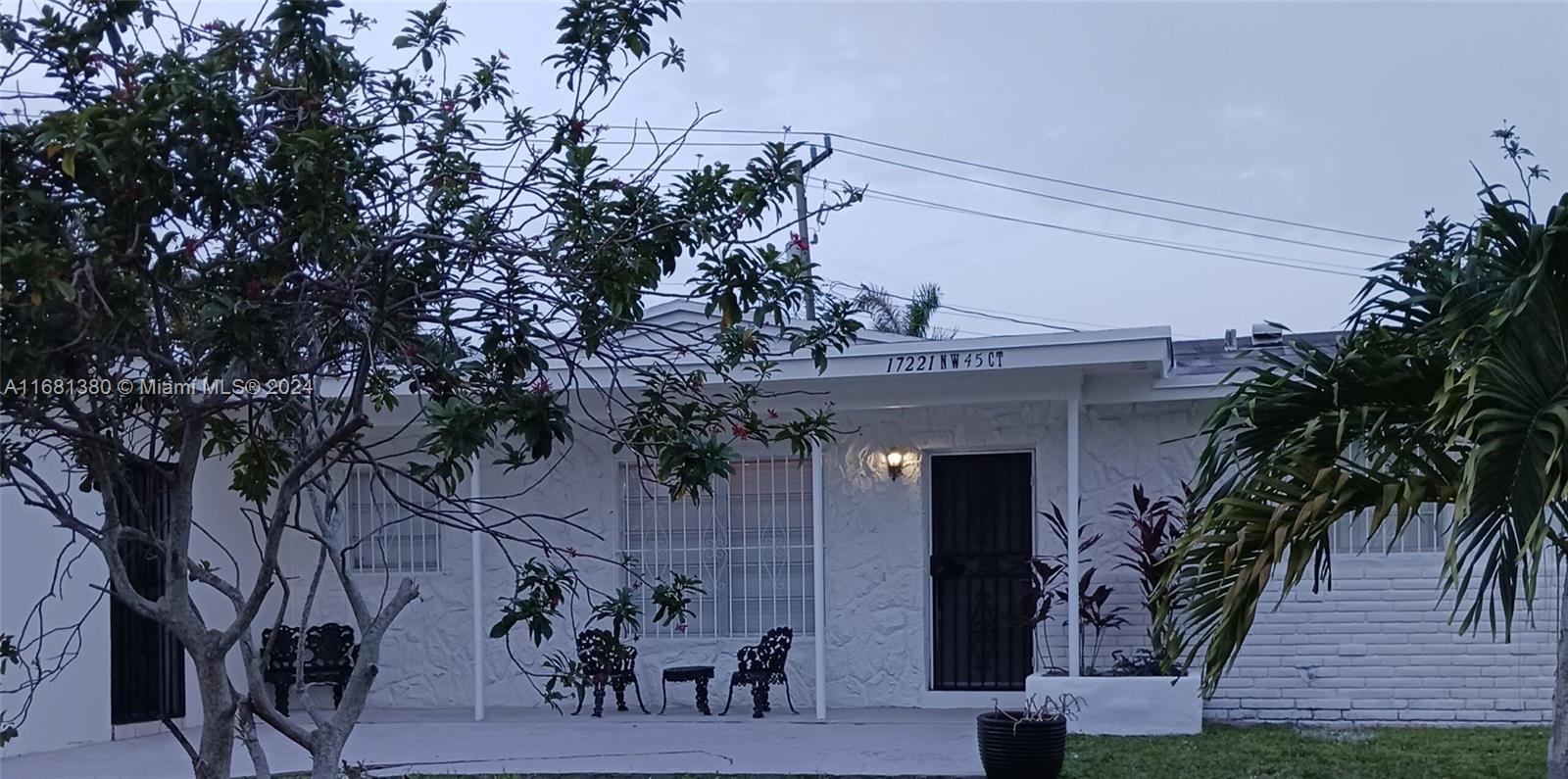 view of a house with a tree